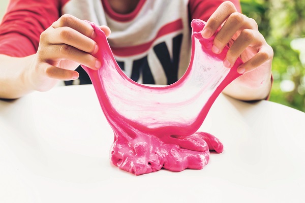 Hand Holding Homemade Plaything Called Slime, Teenager Having Fu