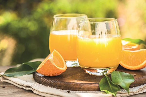 Glass Of Fresh Orange Juice,ripe Orange Fruit And Slices On Natu
